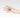 Hand wearing a silver ring in a teardrop shape with a green chrysoprase gemstone