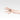 Hand wearing a square top ring with a smoked quartz centerpiece and pink tourmaline accents, set in fine and sterling silver.