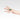 Hand wearing a silver ring in a teardrop shape with a green chrysoprase gemstone
